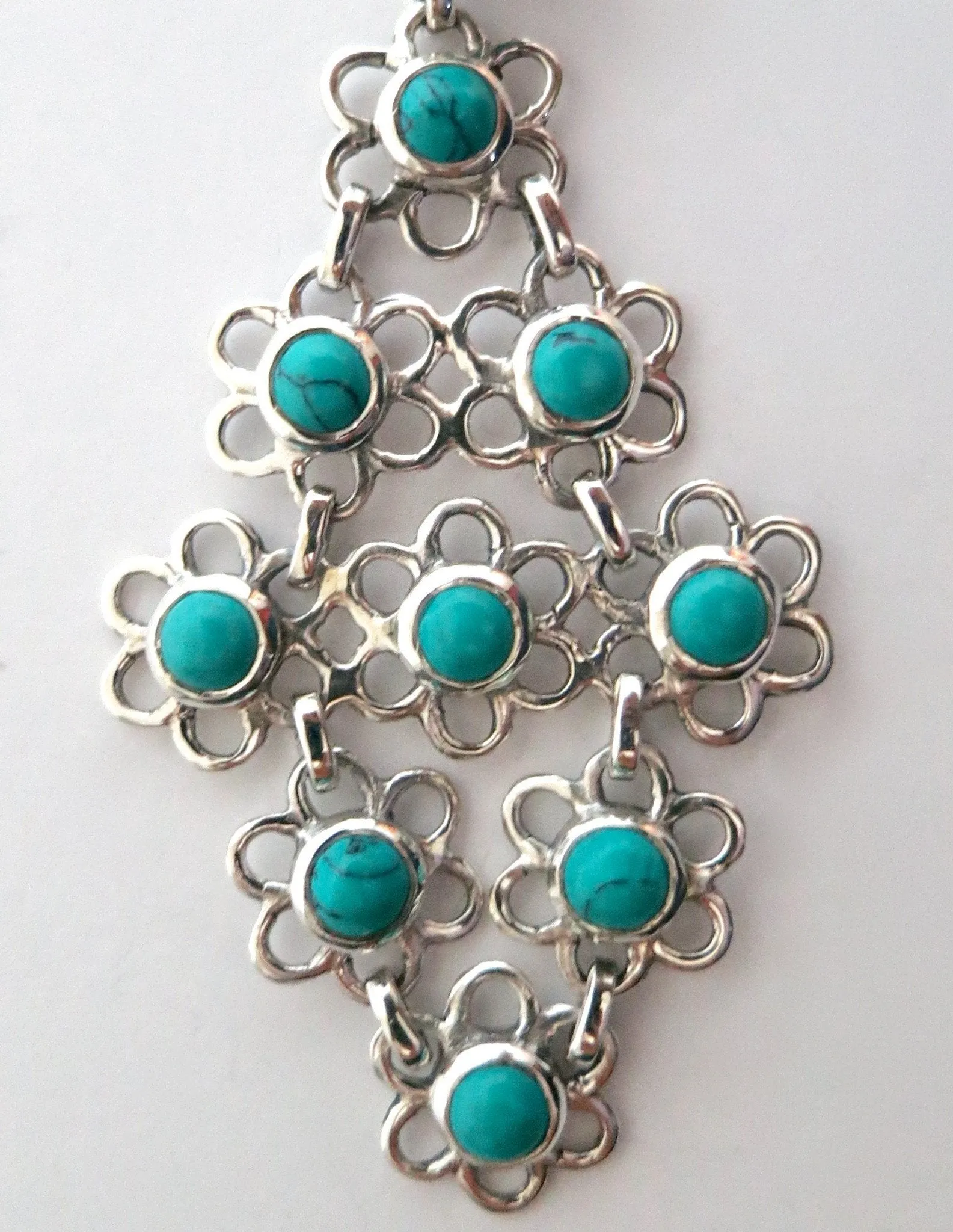 Chic and artistic, Samarkand linked floral units flexible turquoise pendant