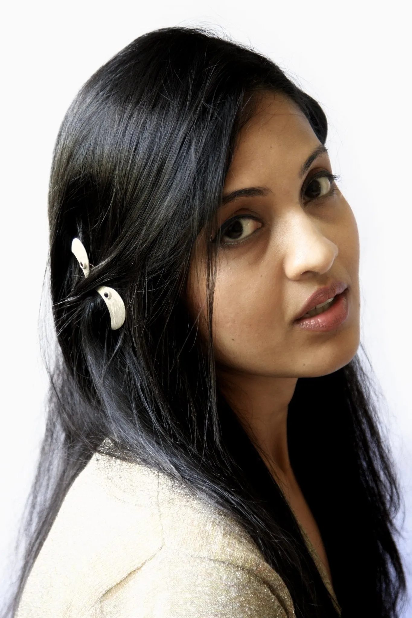 Chic crescent shape hair clip, accented with garnet