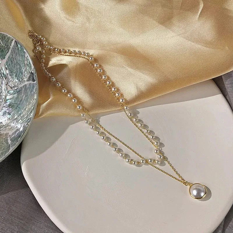 Pack Of 2 Layered Pearl Heart And Lock Pendant